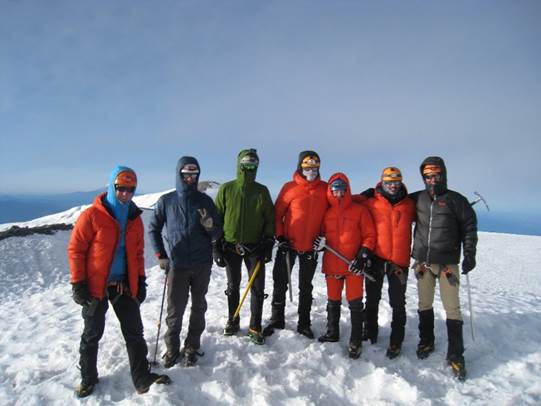 A group of people standing in the snow

Description automatically generated